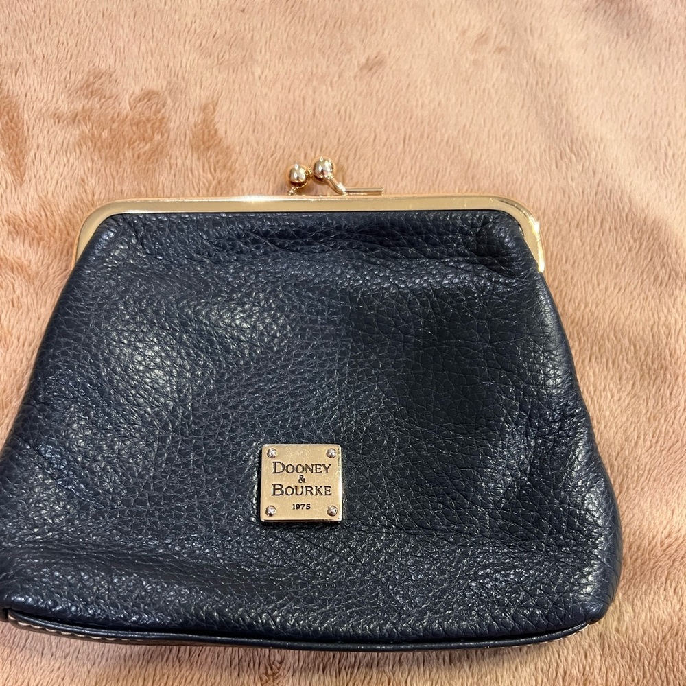 Dooney and Bourke snap wallet with card slots.  Dark color pebble leather